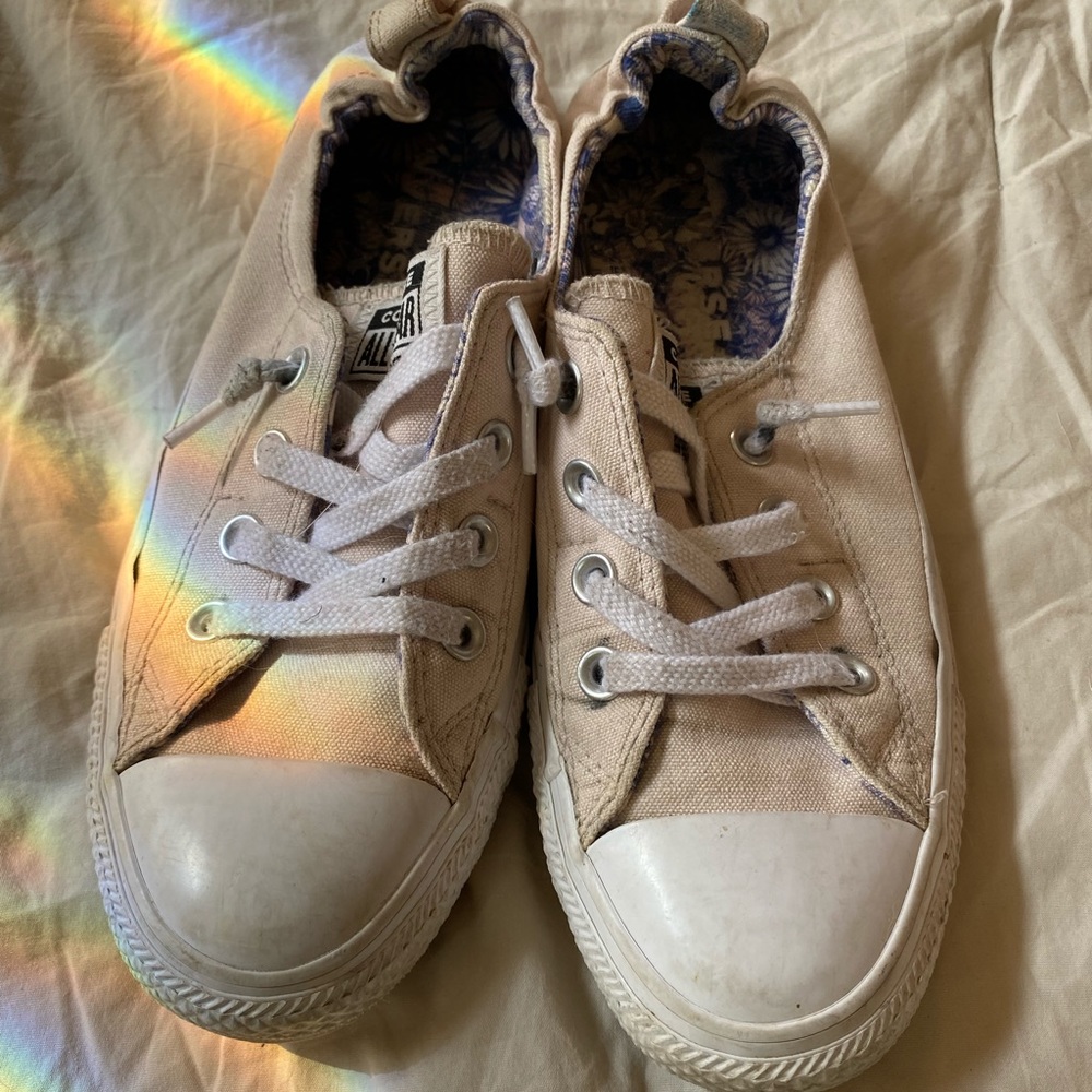 Light pink slip on Converse low tops